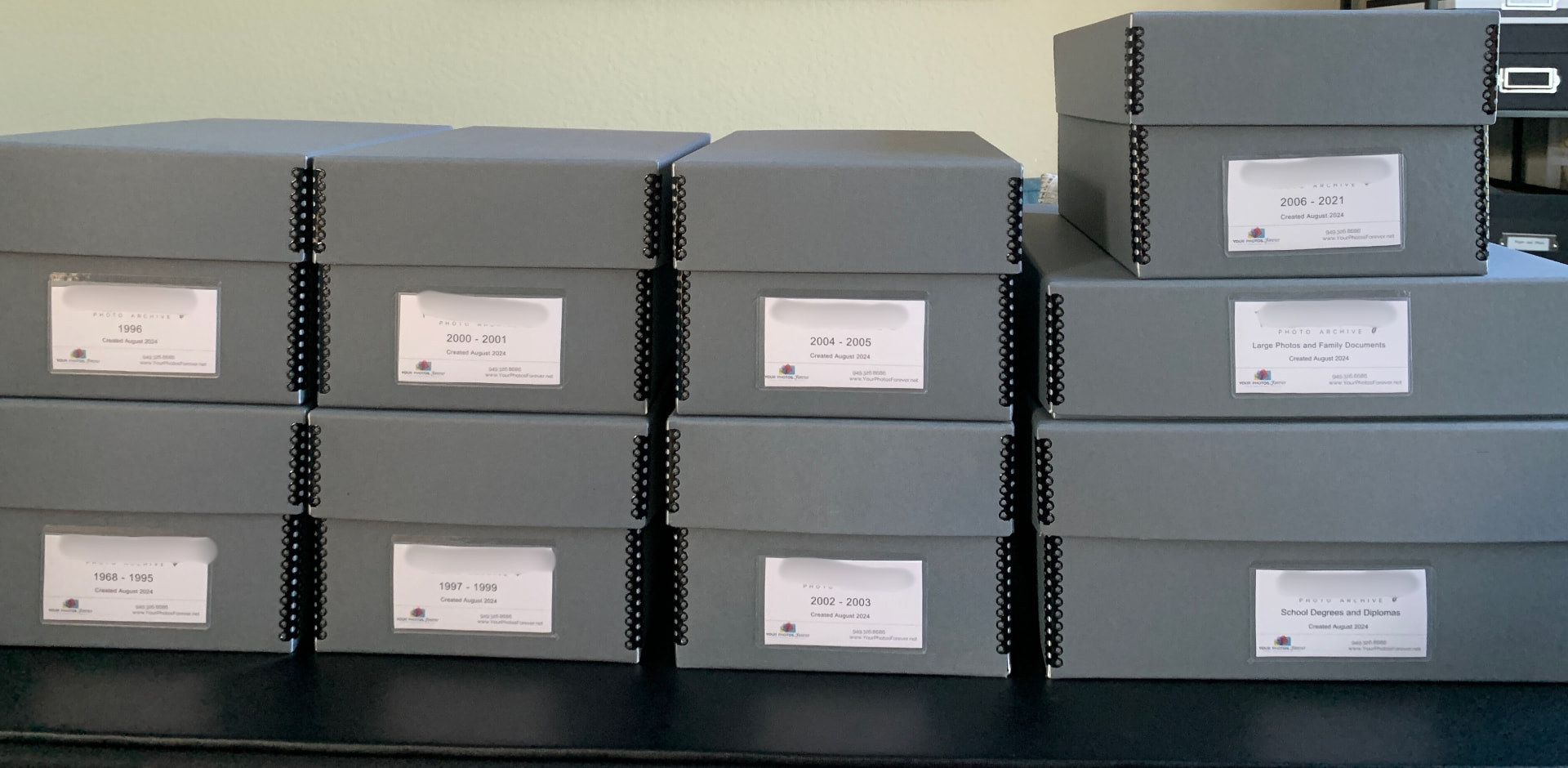Labeled archival storage boxes organized by year and category